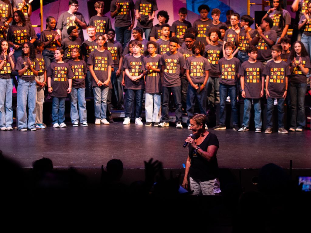 Donna with Summer Stars campers on stage